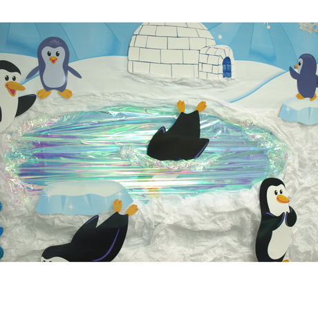 penguins swimming in iridescent film]